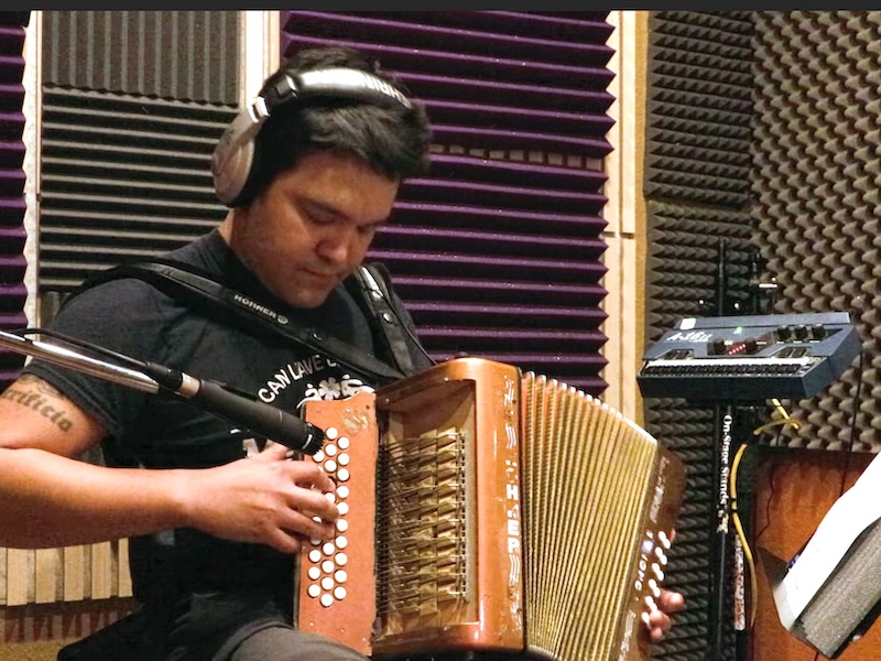 accordionist playing in music studio